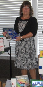 Pictured is Back to Basics Learning Dynamics Assistant Director Jeanine Stidham with just a few of the more than 200 new books for the expanded Back to Basics library.