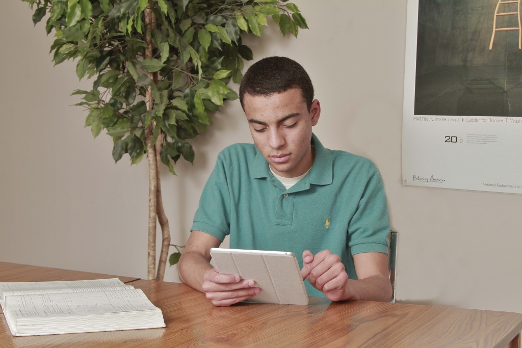 2015, teen boy holding iPad