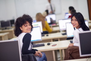 students group in computer lab classroom